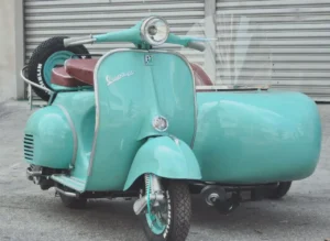 Vintage Vespa sidecar in pastel turquoise fitted as a mobile ice-cream pop-up at a Singapore brand activation
